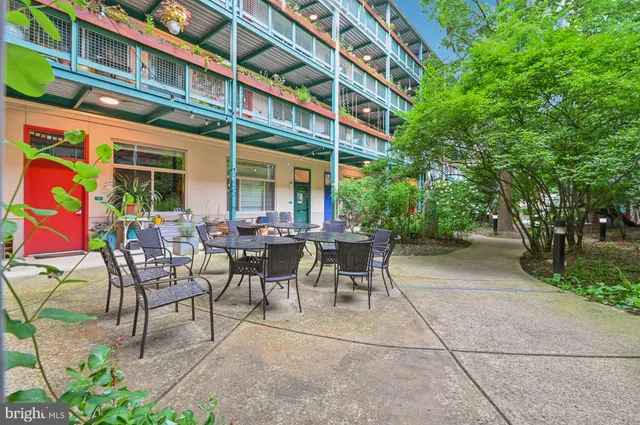 a view of a building with sitting area