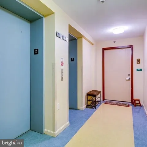 a view of room with furniture and wooden floor