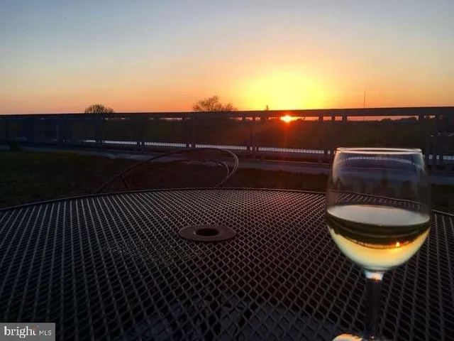 a view of balcony with wooden floor and city view