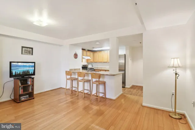 a view of kitchen with furniture and wooden floor