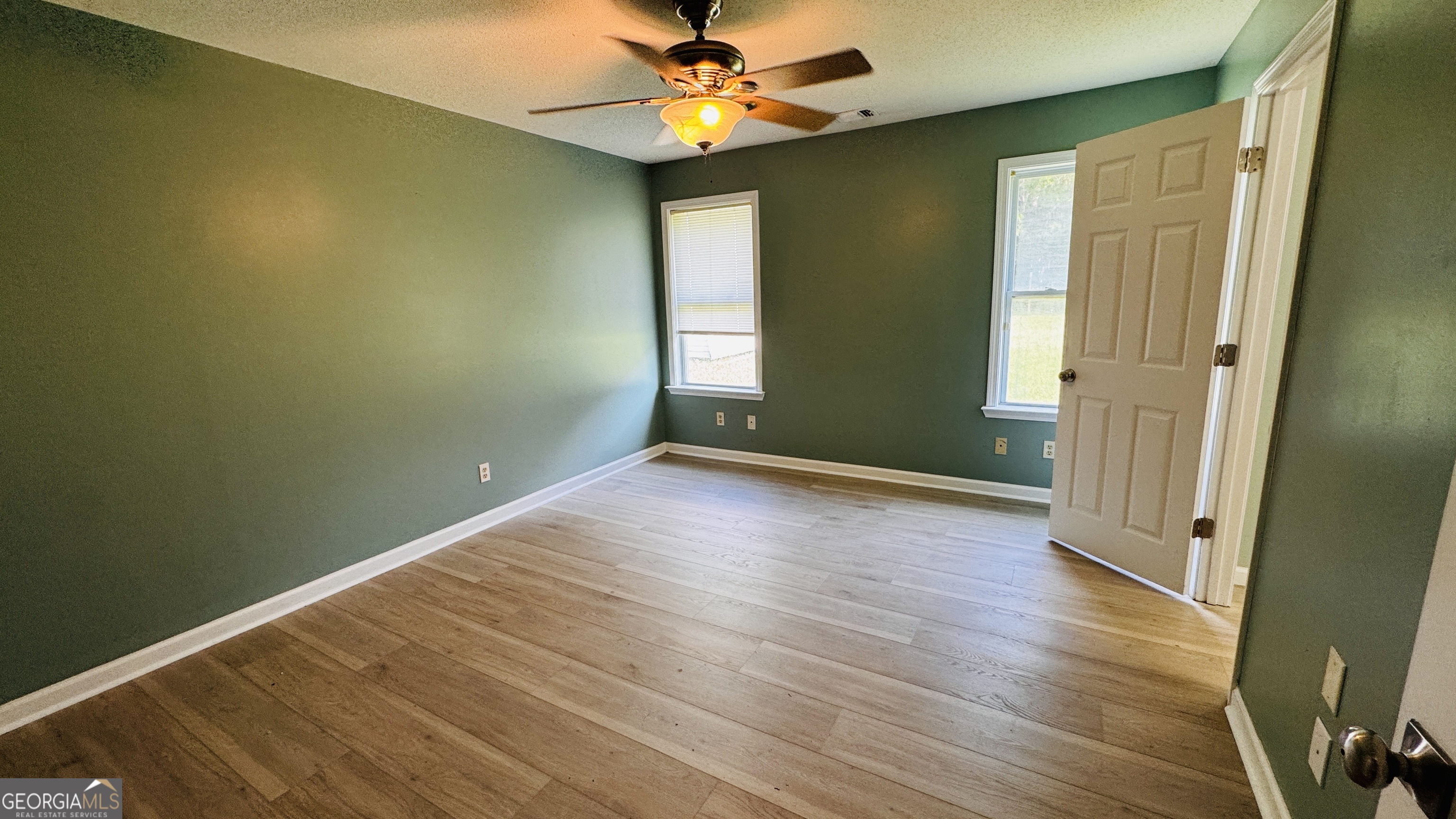 512 Antietum Road Collins, GA 30421 - Photo 8 of 16 a view of room with window and wooden floor