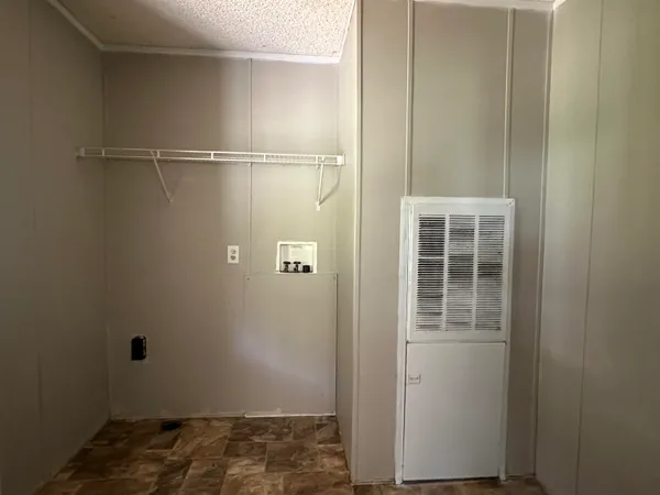 a view of a room with racks on the wall