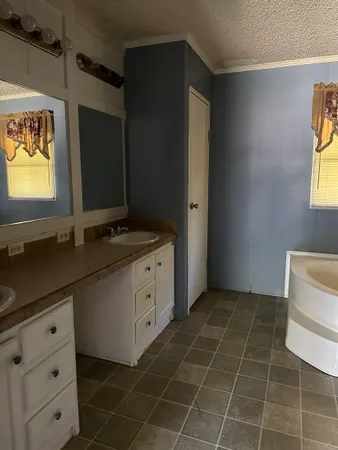 a room with a black white cabinet and a flat screen tv