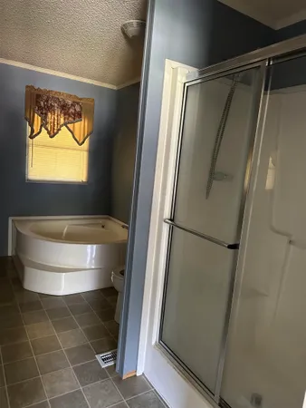 a bathroom with a bathtub and a shower