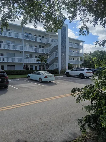 a buildings with car parked