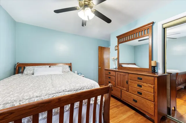 a bedroom with a bed and a dresser