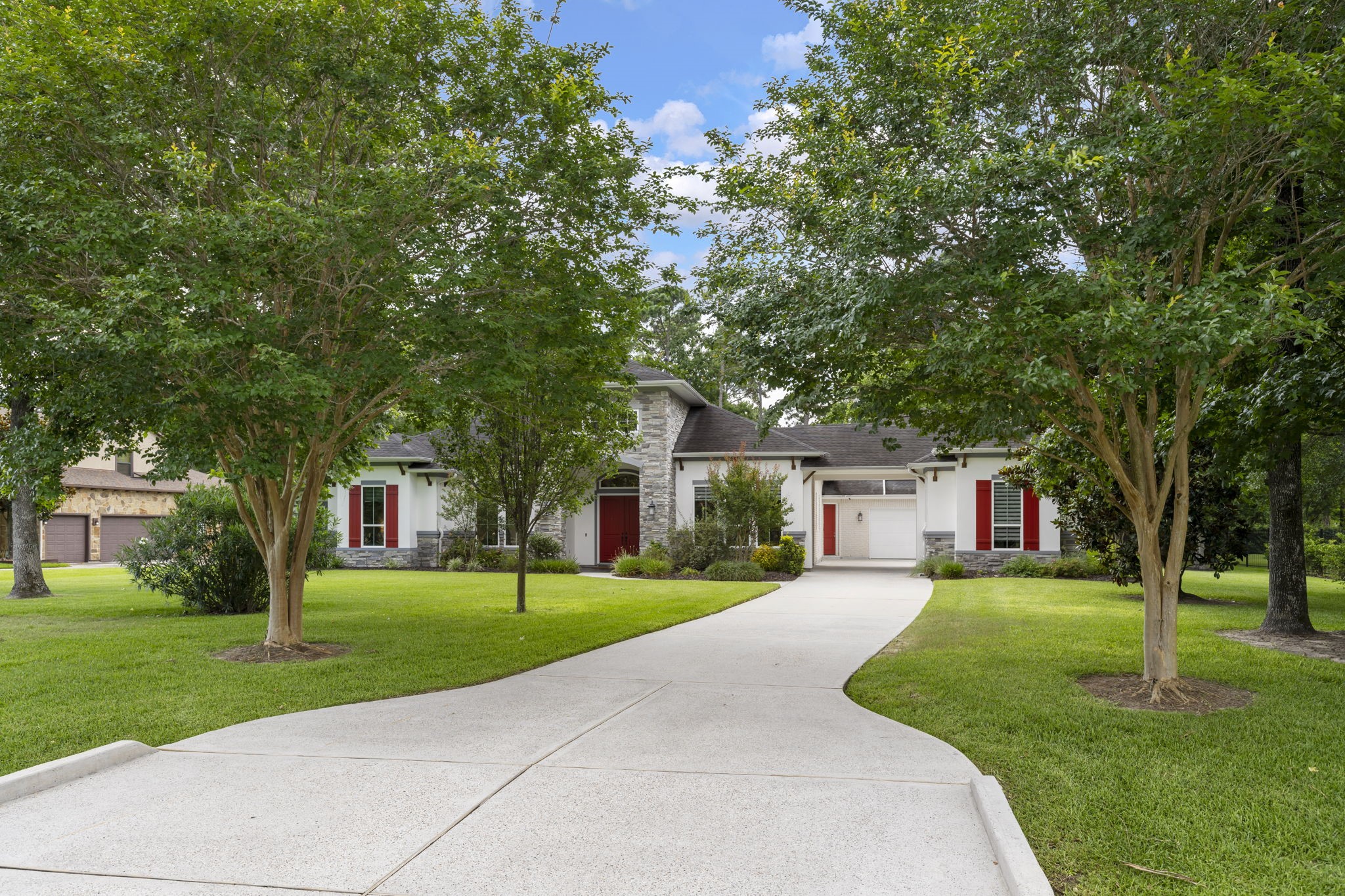 3918 Almond Court Spring, TX 77386 - Photo 5 of 42 a front view of a house with a yard and trees