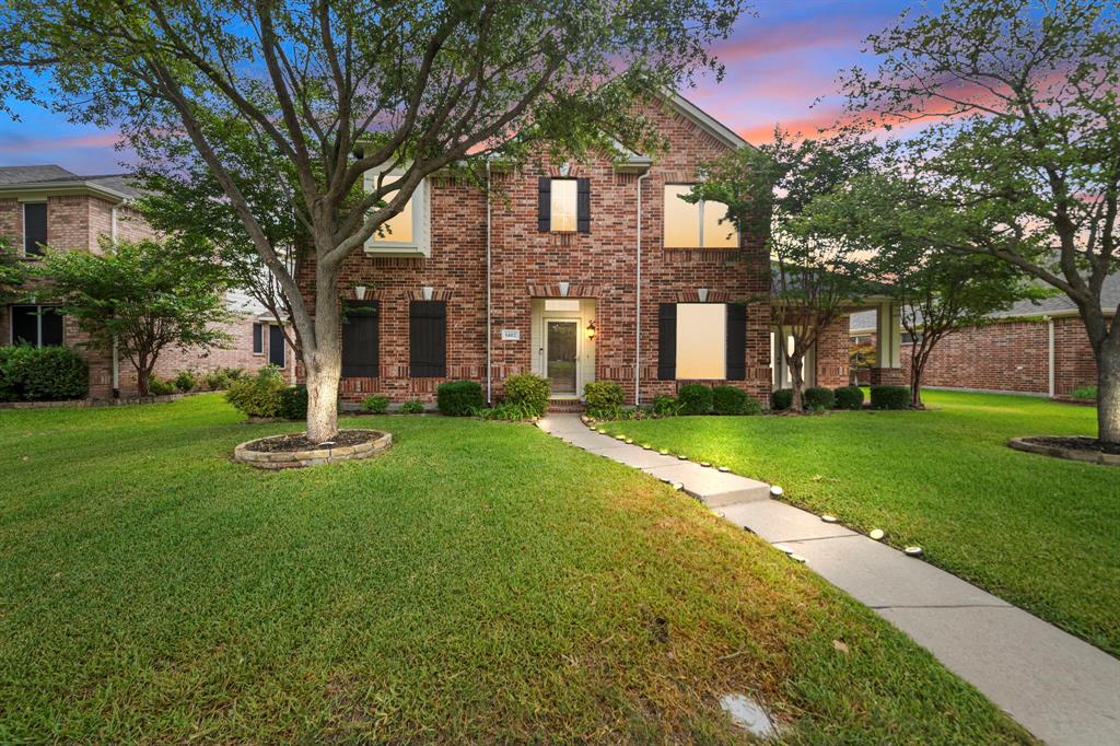 View of front of property with a lawn