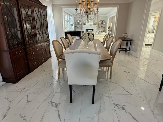 a bedroom with a bed and a lamp on dresser