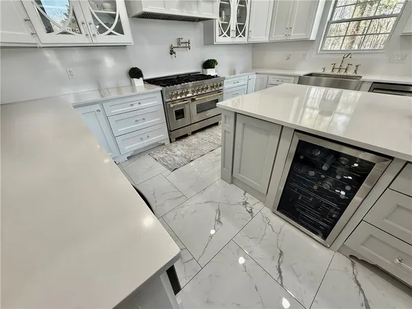 a utility room with sink dryer and washer