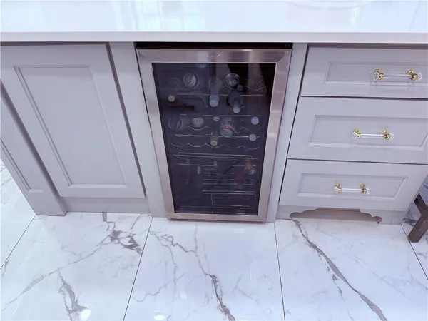 a bathroom with a granite countertop sink toilet a mirror and a tub