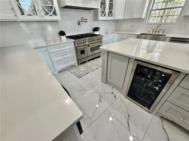 a bathroom with a shower and a sink