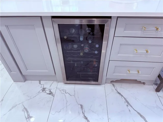 a utility room with sink dryer and washer
