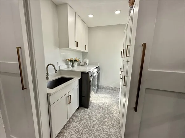 a white toilet sitting next to a bathroom sink