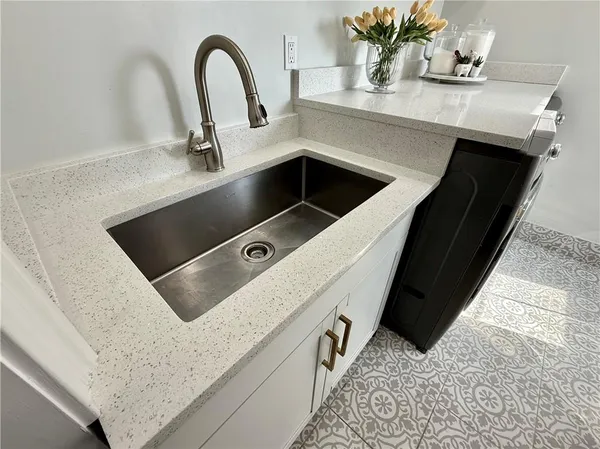 a view of an empty room and fire place