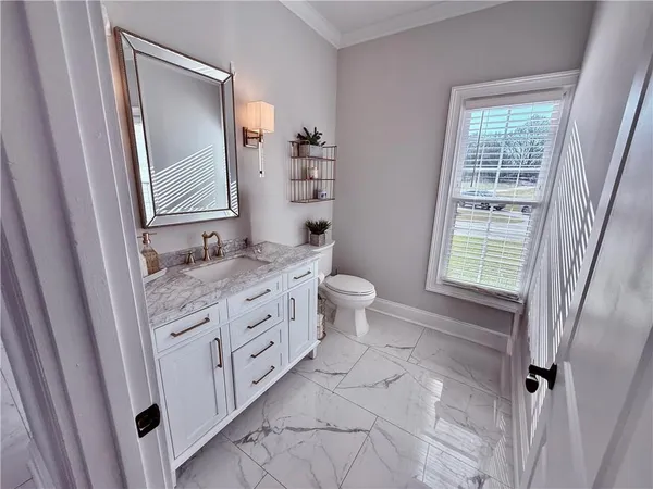 a kitchen with stainless steel appliances granite countertop a refrigerator stove and microwave