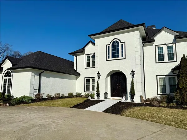 a view of entryway and hall with dining room