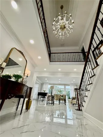a lobby with furniture and floor to ceiling window