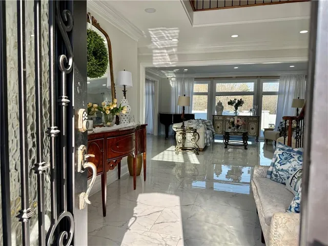 a view of a dining room with furniture and window