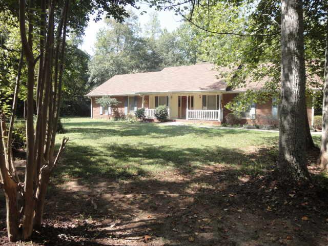 311 Rising Star Road Fayetteville, GA 30215 - Photo 1 of 1 a backyard of a house with table and chairs