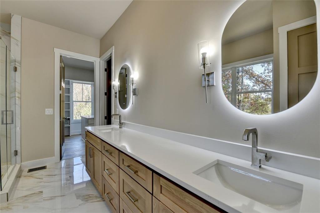 2881 Traditions Way Jefferson, GA 30549 - Photo 18 of 59 a bathroom with a sink and a mirror
