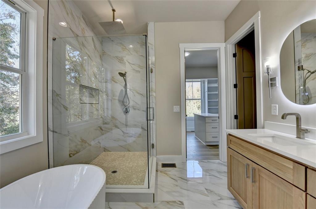 2881 Traditions Way Jefferson, GA 30549 - Photo 19 of 59 a bathroom with a sink a toilet and shower