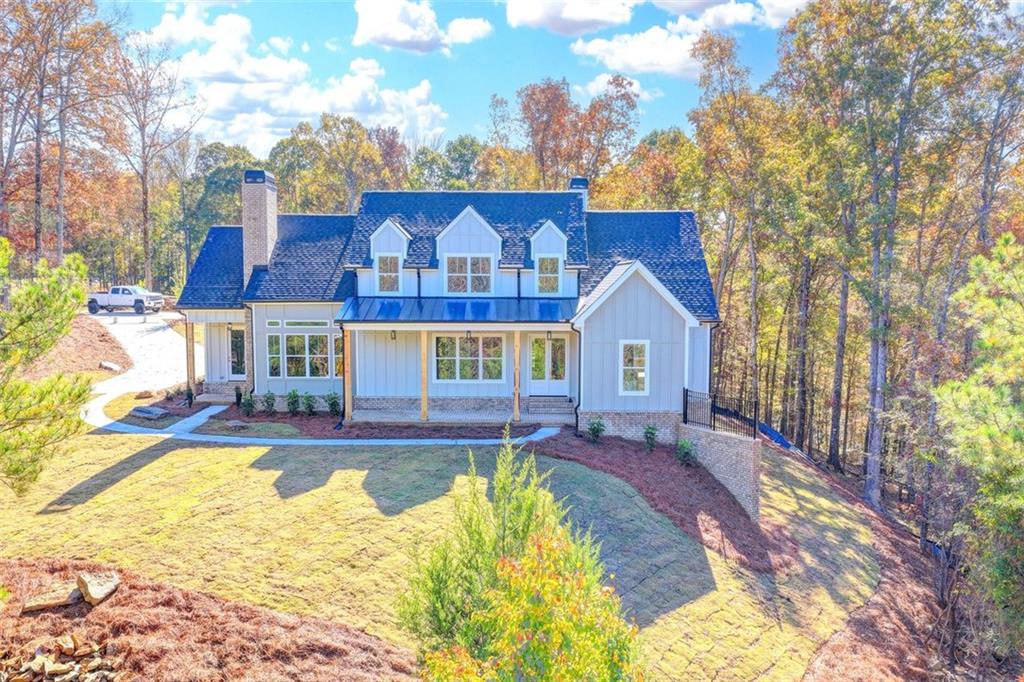 2881 Traditions Way Jefferson, GA 30549 - Photo 2 of 59 a view of house with yard outdoor seating and entertaining space