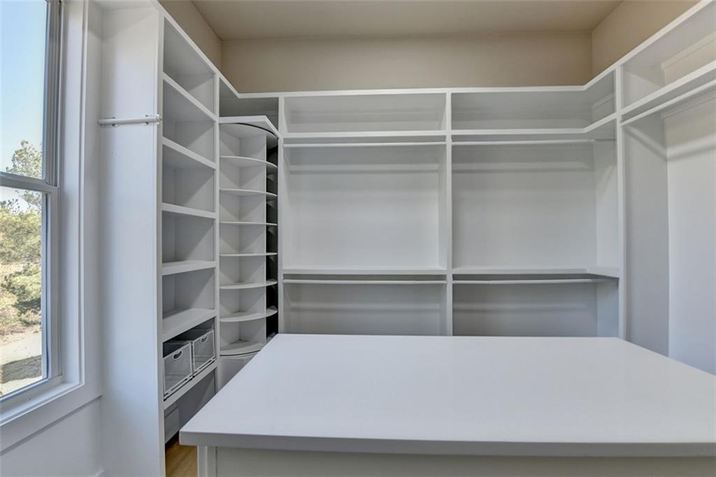 2881 Traditions Way Jefferson, GA 30549 - Photo 23 of 59 a view of an empty walk in closet