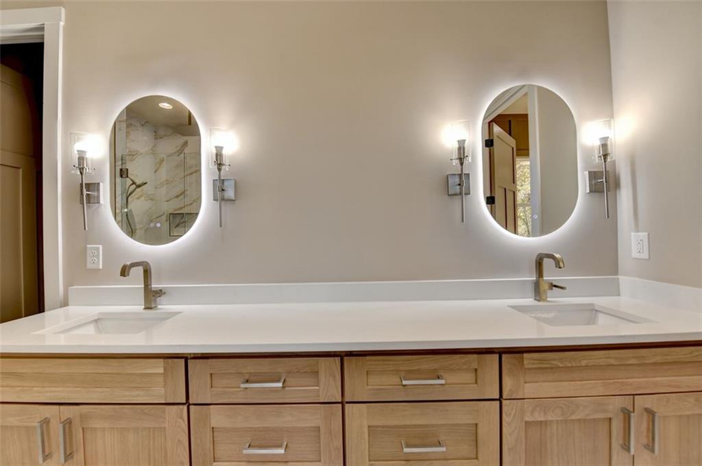 2881 Traditions Way Jefferson, GA 30549 - Photo 24 of 59 a bathroom with a sink and a mirror