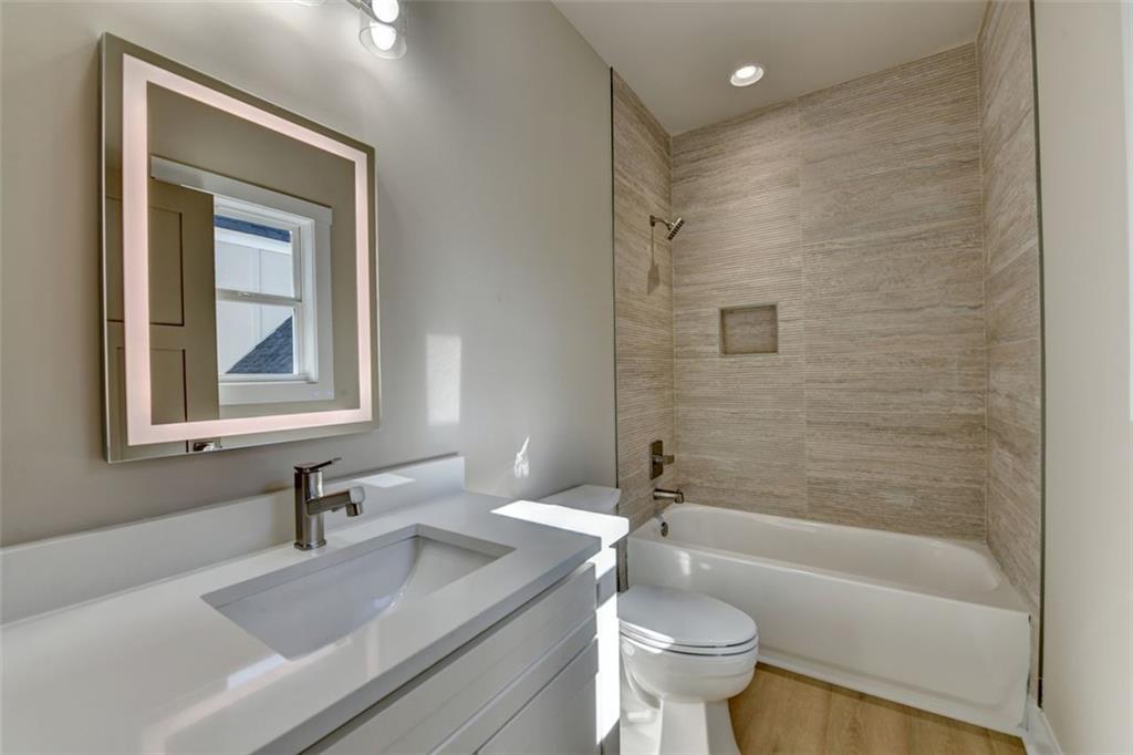 2881 Traditions Way Jefferson, GA 30549 - Photo 27 of 59 a bathroom with a sink a toilet and a bathtub