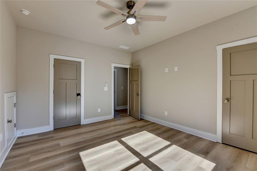 2881 Traditions Way Jefferson, GA 30549 - Photo 29 of 59 wooden floor in an empty room with a window