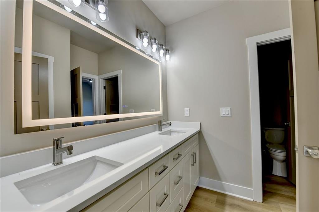 2881 Traditions Way Jefferson, GA 30549 - Photo 30 of 59 a bathroom with double vanity and a mirror