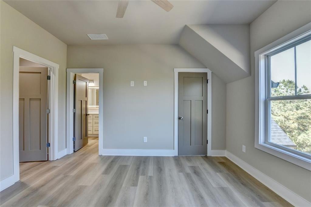 2881 Traditions Way Jefferson, GA 30549 - Photo 32 of 59 a view of an empty room with glass door and a window