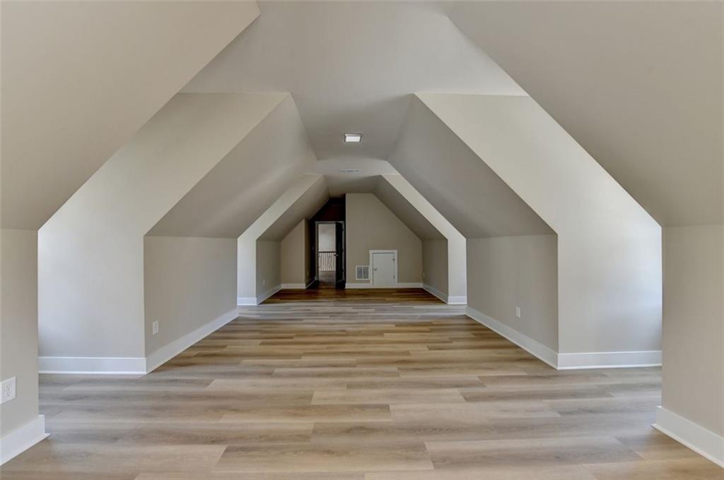 2881 Traditions Way Jefferson, GA 30549 - Photo 35 of 59 a view of empty room with wooden floor