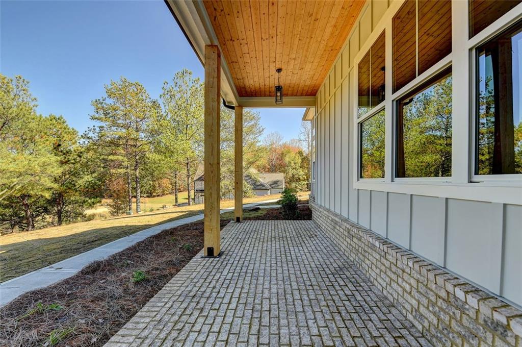2881 Traditions Way Jefferson, GA 30549 - Photo 38 of 59 a view of a room with wooden floor and a bench