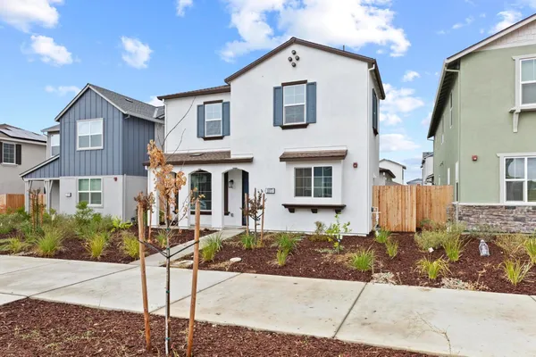 a front view of a house with street