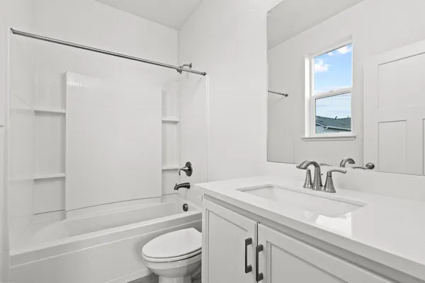 a bathroom with a sink a toilet and a bathtub