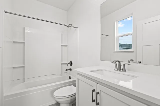 a bathroom with a sink a toilet and a bathtub