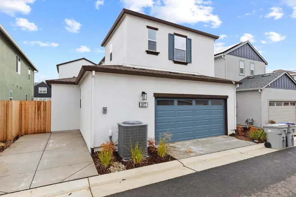 a front view of a house with garage
