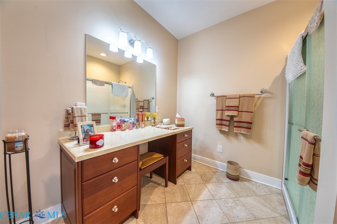 120 North Shore Road Locust Hill, VA 23092 - Photo 16 of 39 Bathroom with a shower stall, vanity, and light tile patterned floors