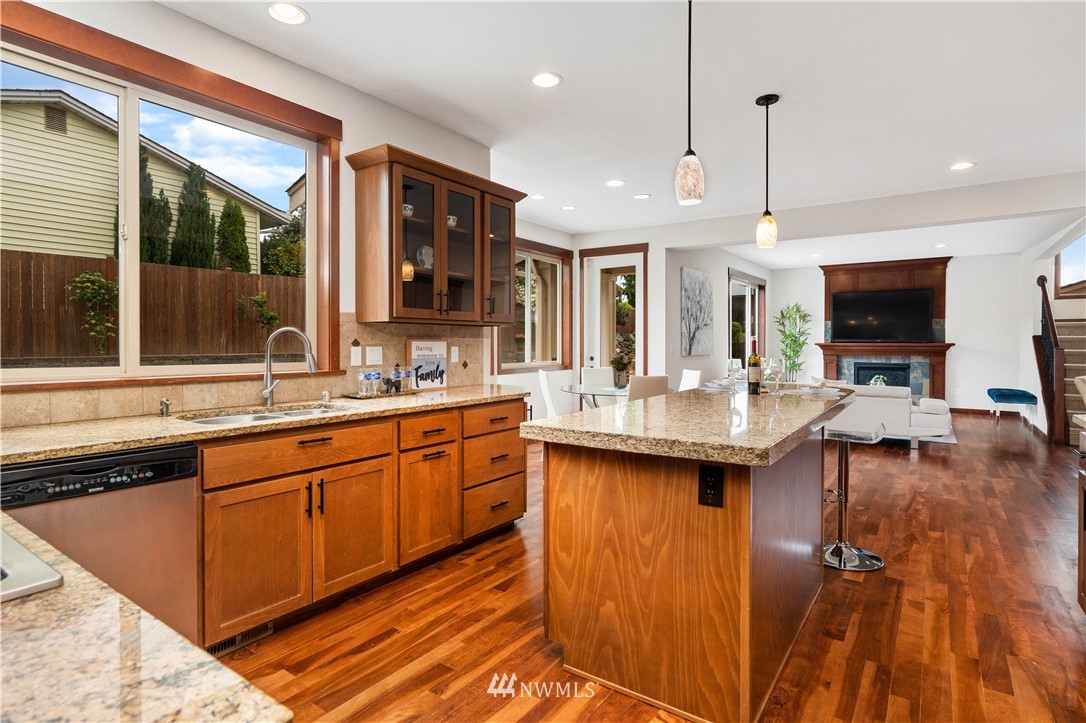 1317 North 40th Street Renton, WA 98056 - Photo 17 of 40 a large kitchen with a large counter top space appliances and cabinets