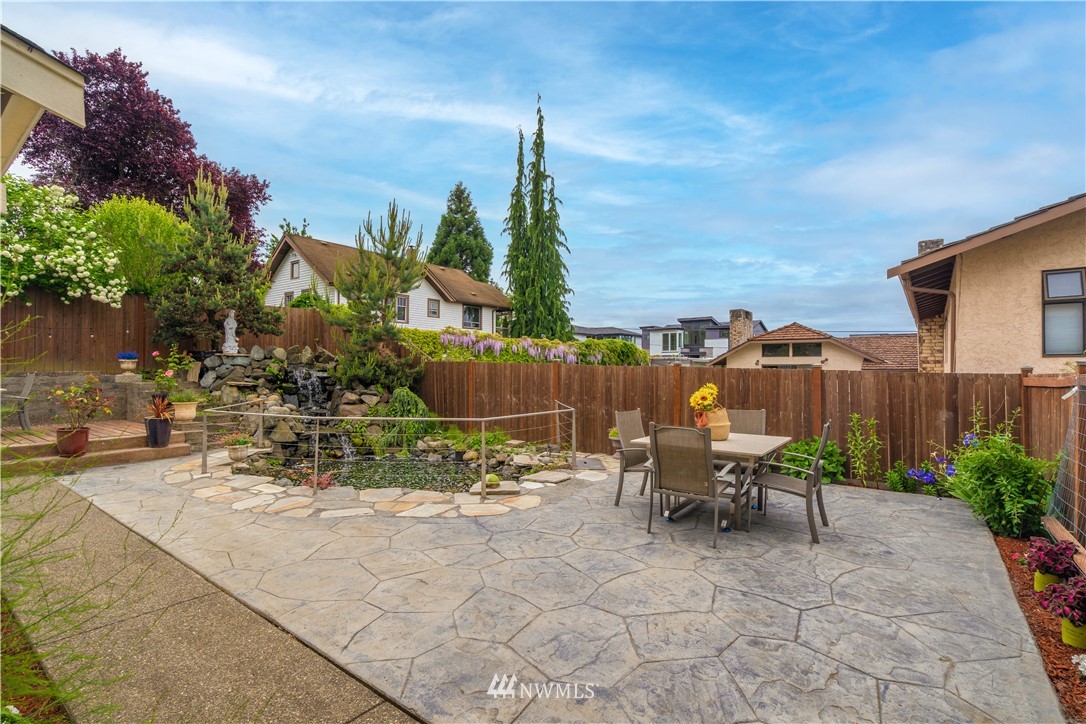 1317 North 40th Street Renton, WA 98056 - Photo 3 of 40 a view of a patio with a table and chairs