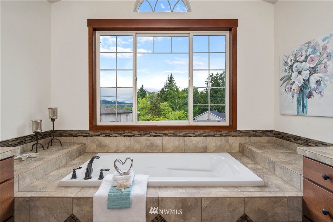 1317 North 40th Street Renton, WA 98056 - Photo 21 of 40 a bathroom with a granite countertop sink and a window