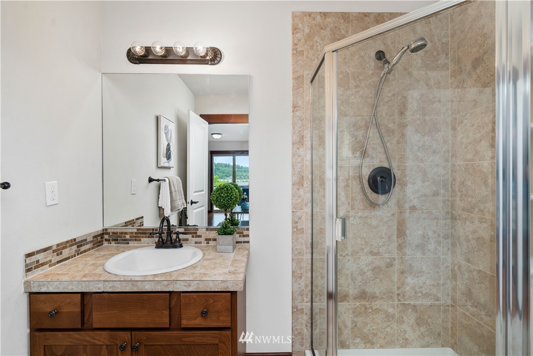 1317 North 40th Street Renton, WA 98056 - Photo 34 of 40 a bathroom with a sink and a mirror