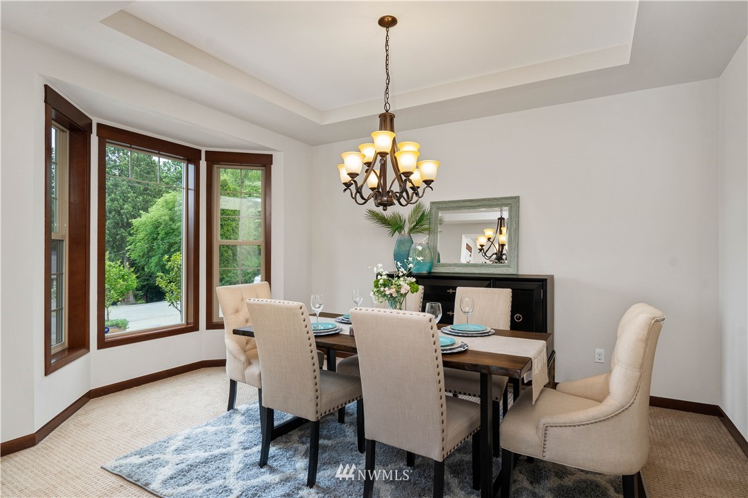 1317 North 40th Street Renton, WA 98056 - Photo 9 of 40 a dining room with furniture a window and a chandelier