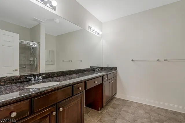 a view of a double sink and a stove in a room