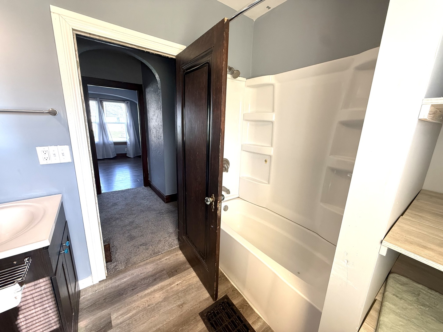 302 West Division Street Amboy, IL 61310 - Photo 16 of 23 a view of a hallway with wooden floor and staircase