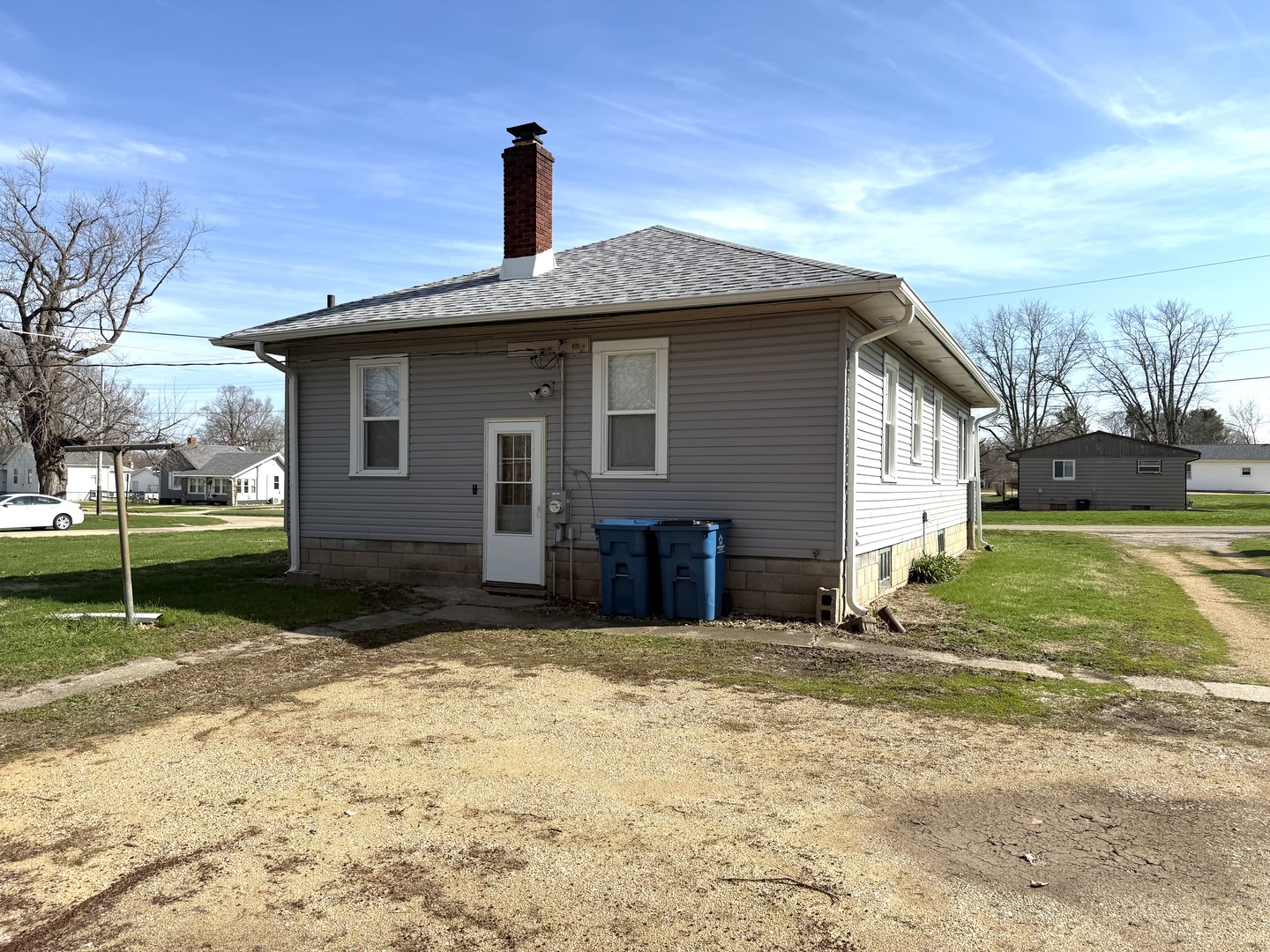 302 West Division Street Amboy, IL 61310 - Photo 5 of 23 a front view of a house with a yard