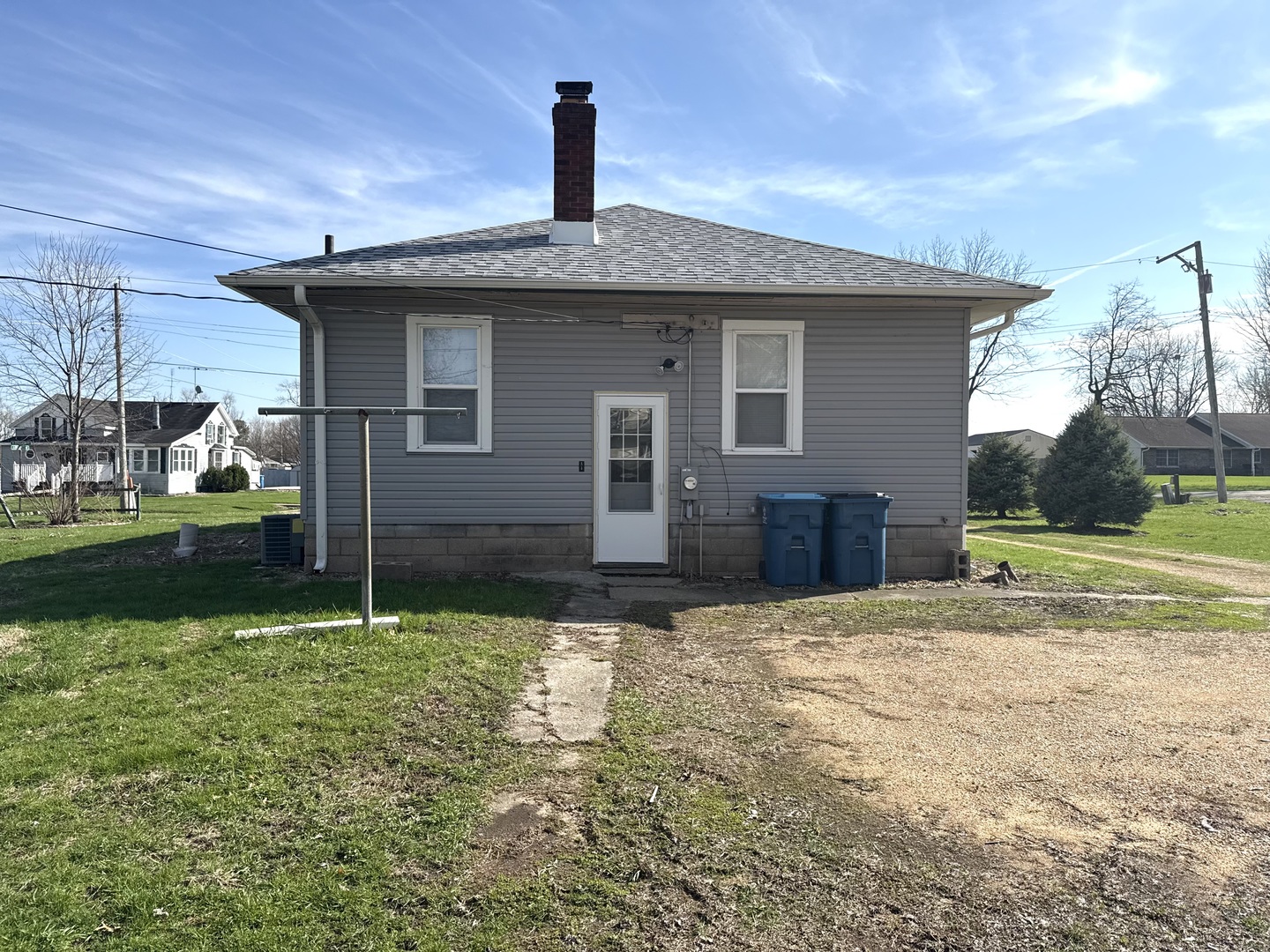 302 West Division Street Amboy, IL 61310 - Photo 7 of 23 a view of a house with a yard