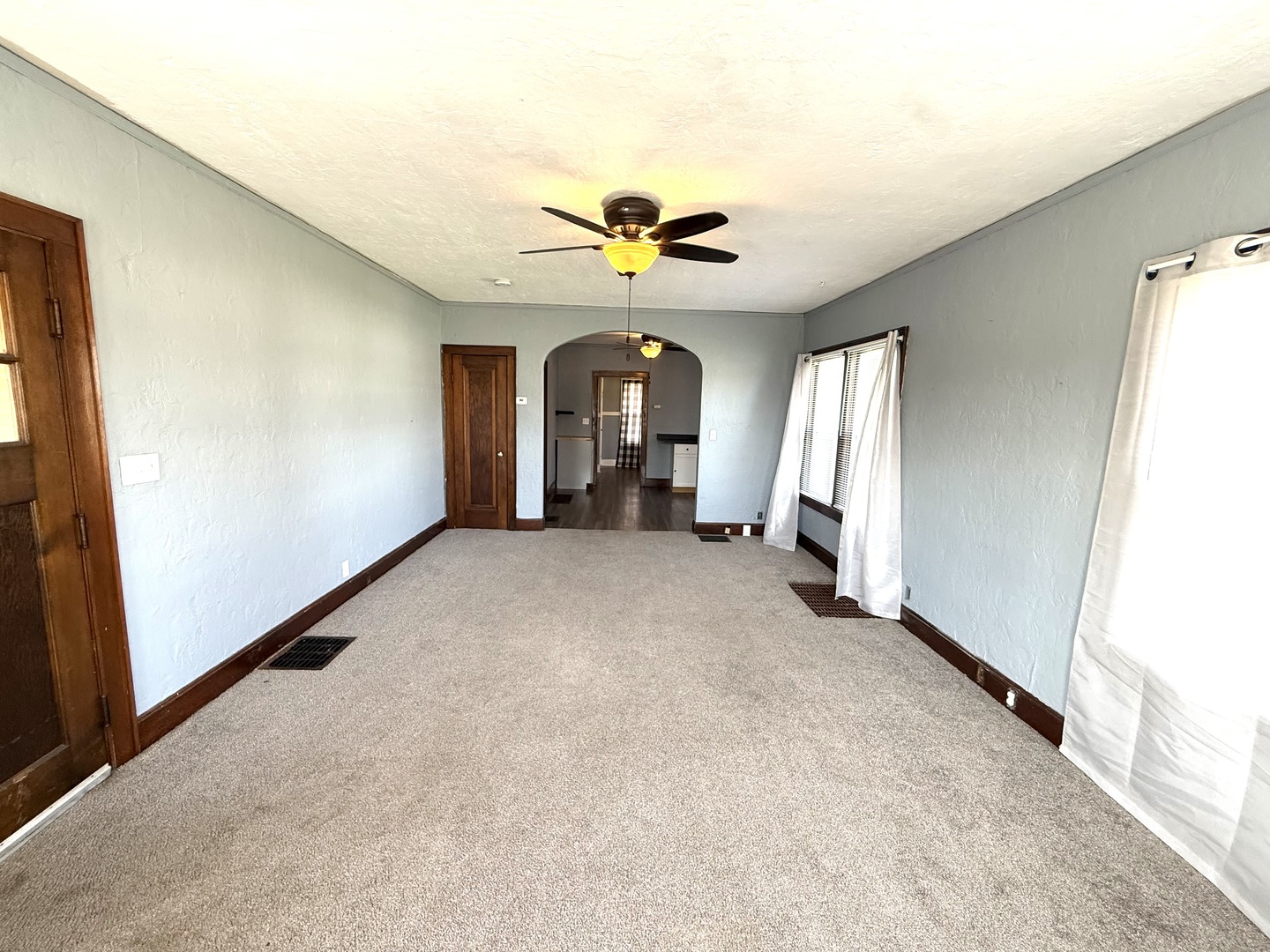 302 West Division Street Amboy, IL 61310 - Photo 8 of 23 a view of an empty room with a window